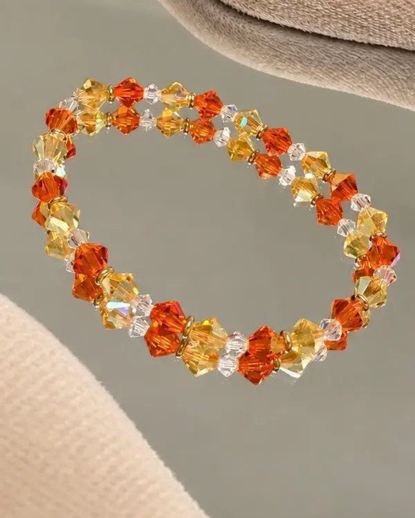 Hand-strung bracelet of orange and yellow crystal glass beads