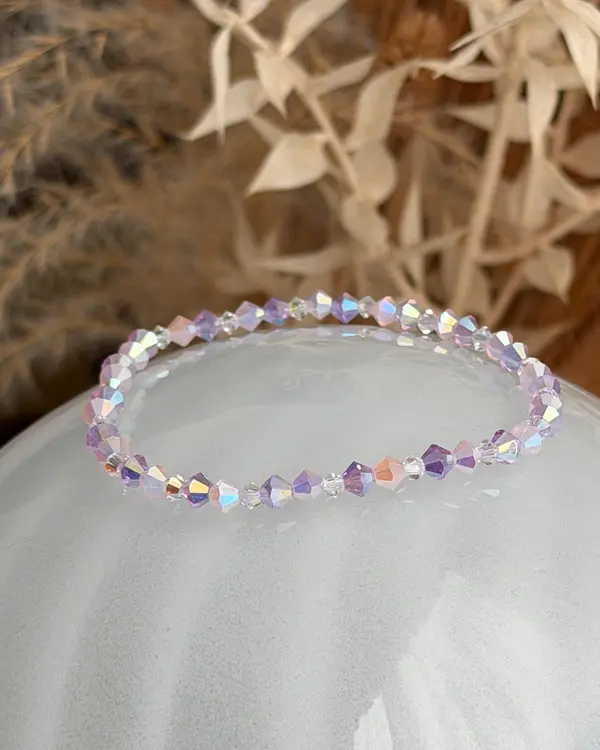 Hand-strung bracelet of violet and rosé shimmering crystal beads